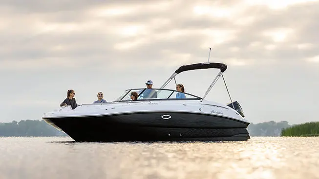 side view of a family having fun on a hurricane sundeck ob boat