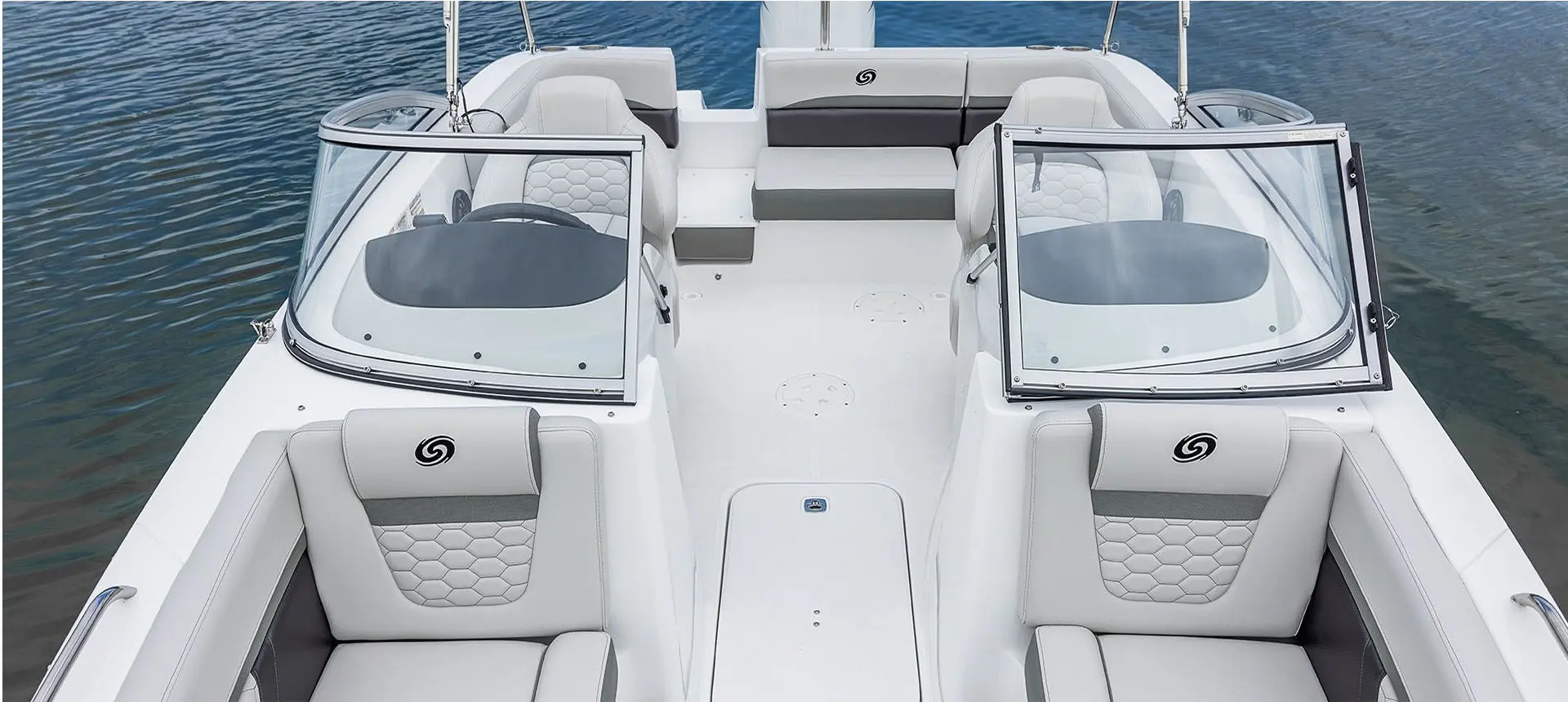 front view of the bow seats and opened walk through windshield on a hurricane sundeck ob boat