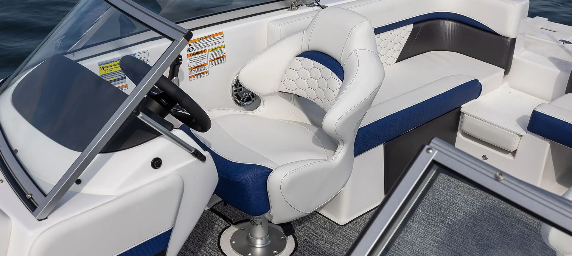 captain's chair at the helm of a hurricane sundeck ob boat