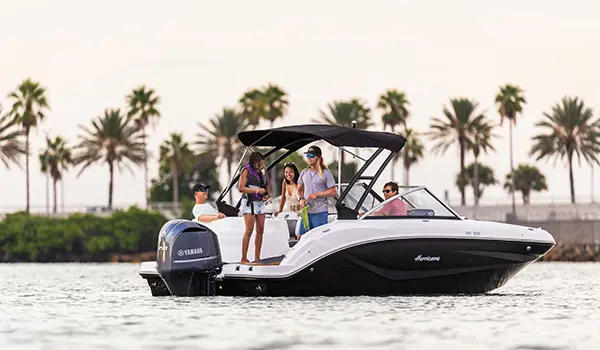 family prepares rope for watersports on hurricane sundeck 235 ob