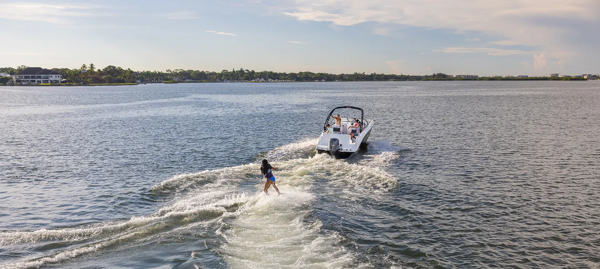 wake boarder gets towed behind a hurricane sundeck 235 ob