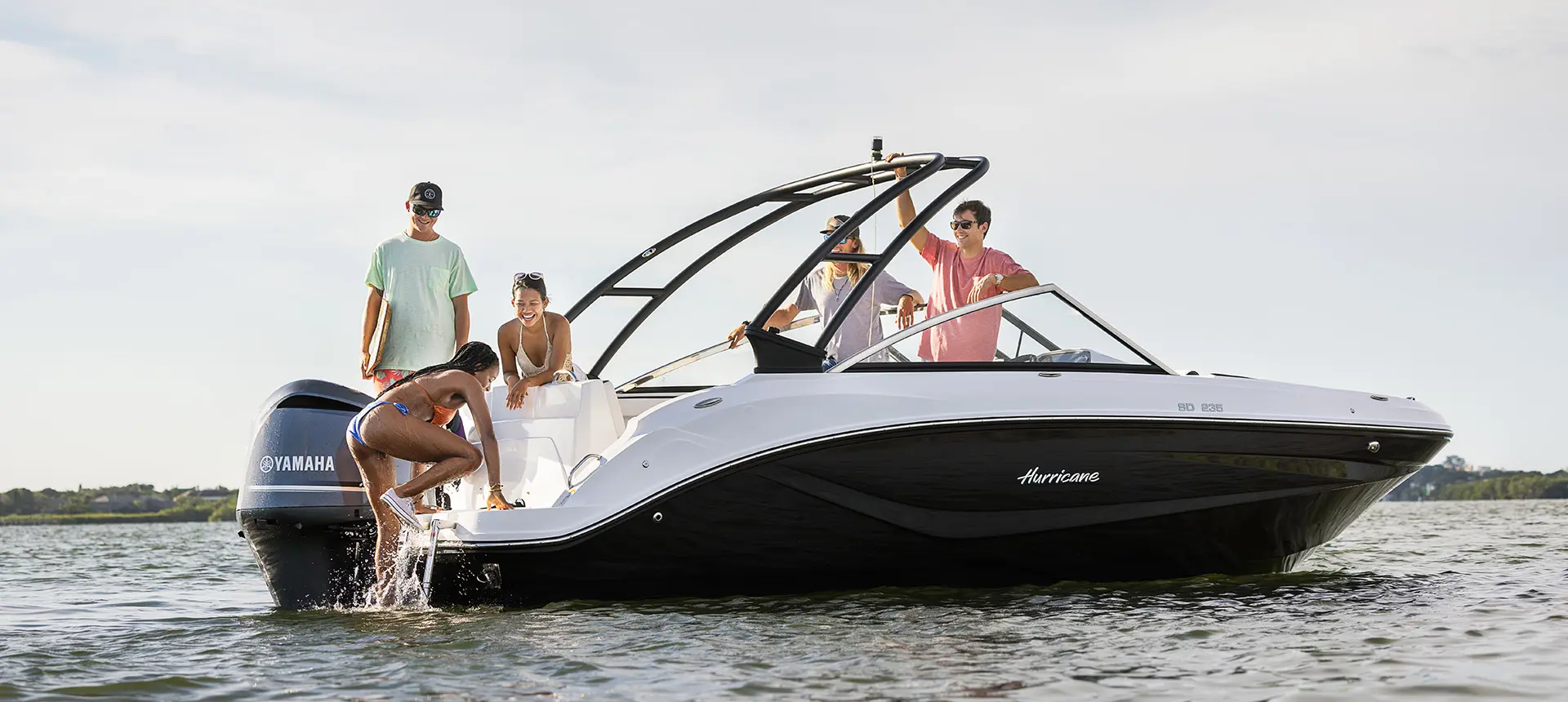 wakeboard rider boards hurricane sundeck 235 ob after being towed