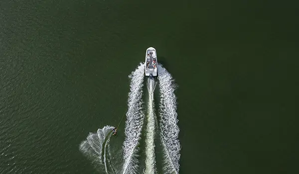 overhead view of hurricane sundeck 235 ob pulling a wakeboarder