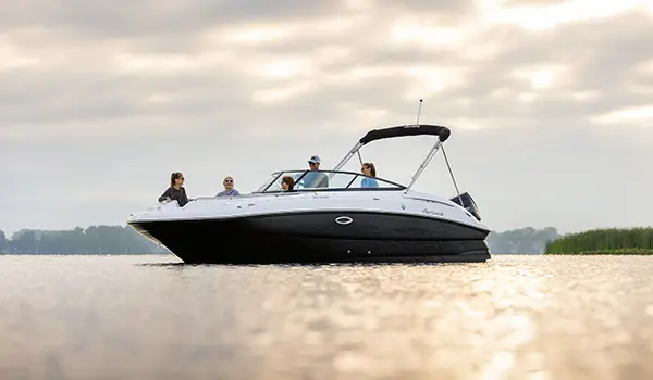 family enjoying the lake on a hurricane sundeck 2400 ob deck boat