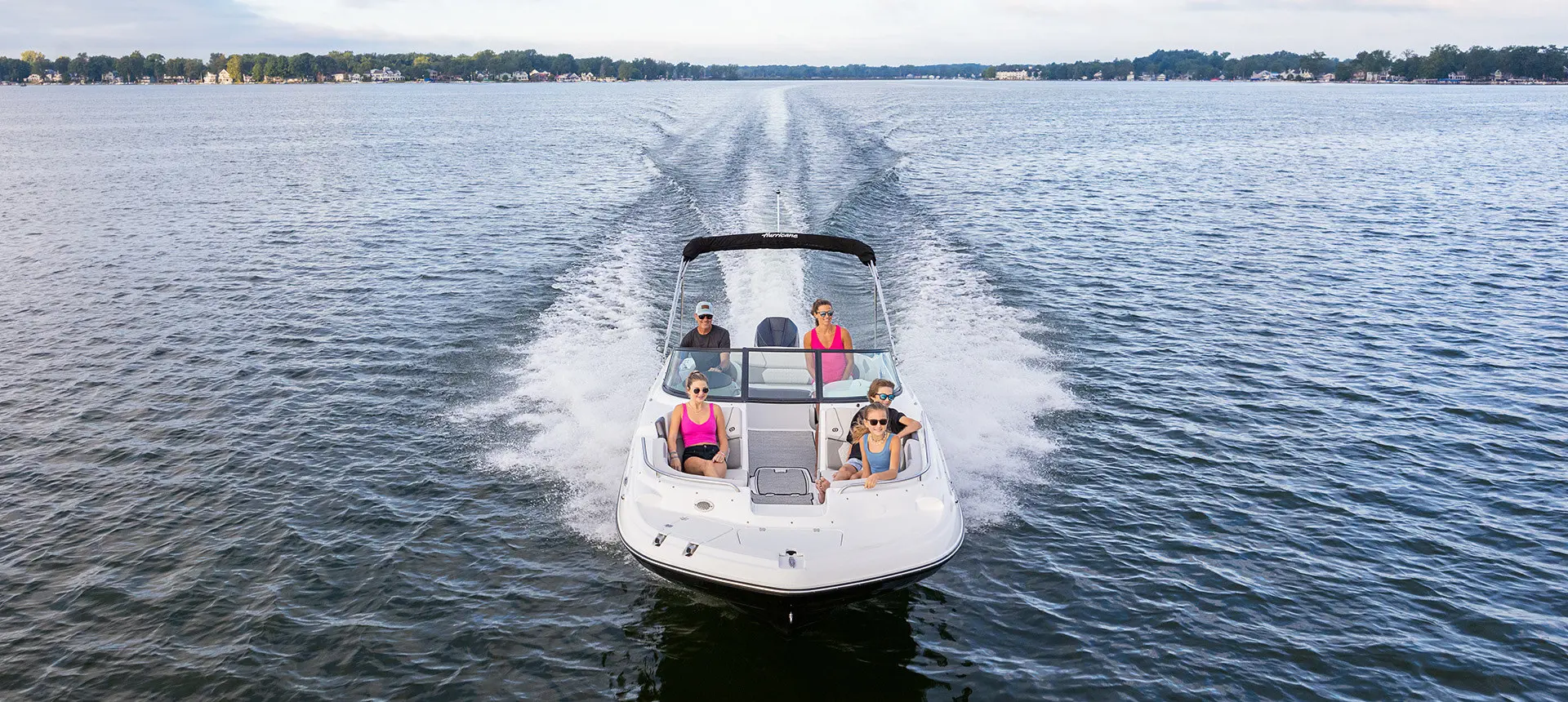 bow focused view of a hurricane sundeck 2400 ob deck boat on lake