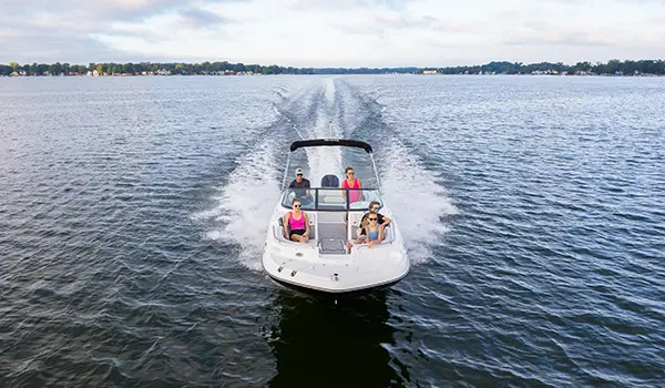 bow focused view of a hurricane sundeck 2400 ob deck boat on lake