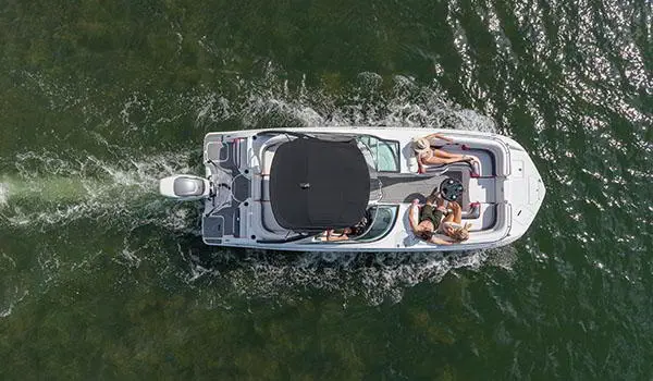 Overhead view of a Hurricane SunDeck 2486 OB cruising on lake.