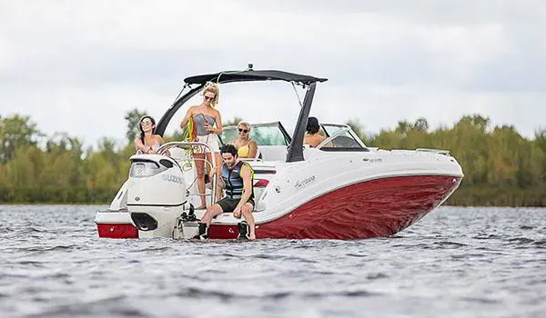 hurricane sundeck 2486 ob parked on water