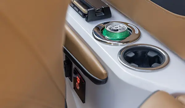 closeup of the cupholders on the helm of a hurricane sundeck 2600 ob deck boat