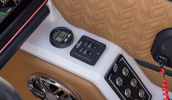 switches on the helm of a hurricane sundeck 2600 ob deck boat