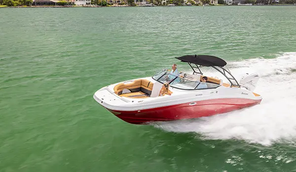 side-aerial view of a hurricane sundeck 2690 ob deck boat speeding across the ocean
