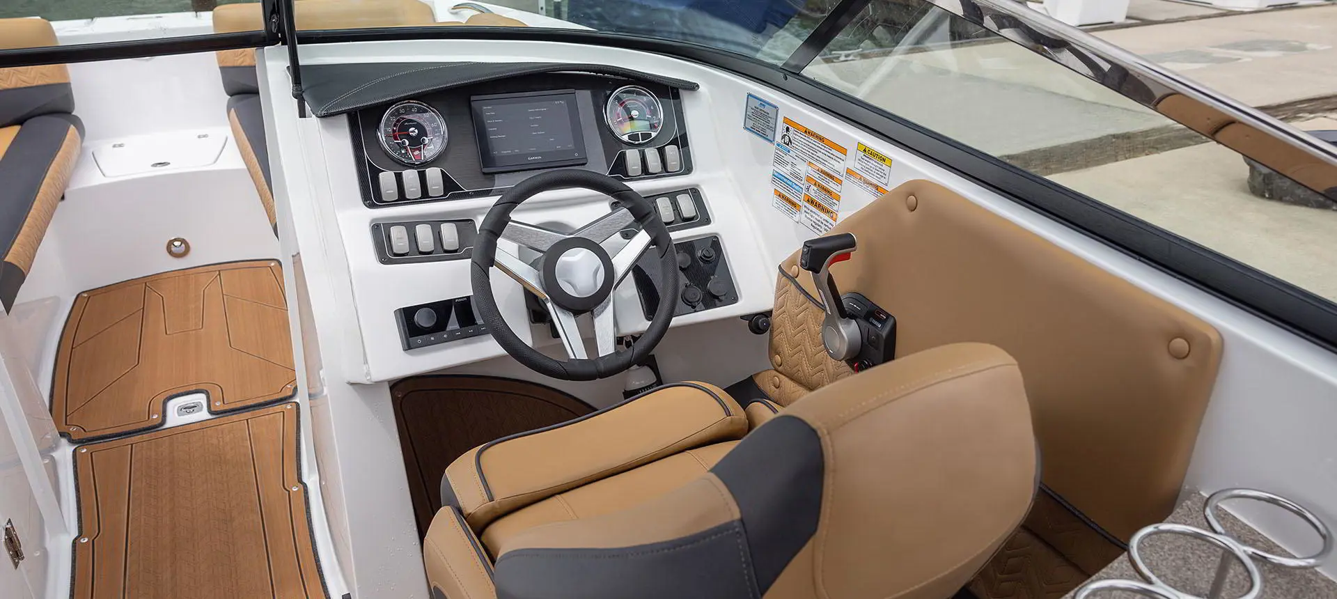 captain's chair and the helm on a hurricane sundeck 2690 ob deck boat