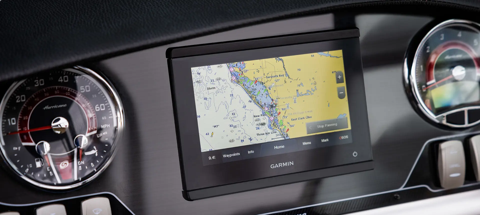 garmin gps and gauges on the helm of a hurricane sundeck 2690 ob deck boat