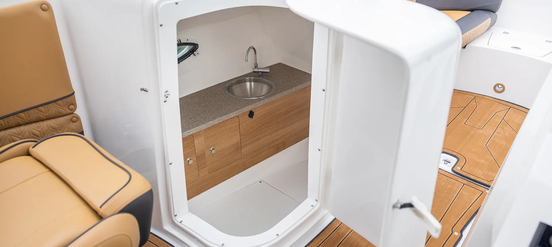 bathroom and wash station on a hurricane sundeck 2690 ob deck boat