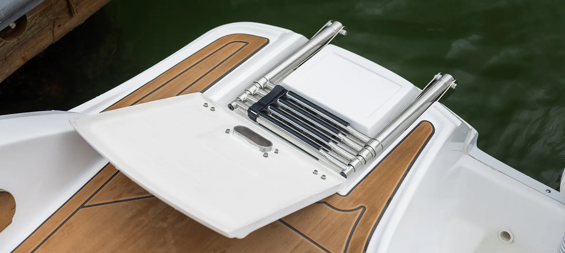 collapsible ladder on the stern of a hurricane sundeck 2690 ob deck boat