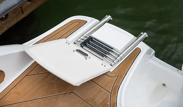 collapsible ladder on the stern of a hurricane sundeck 2690 ob deck boat