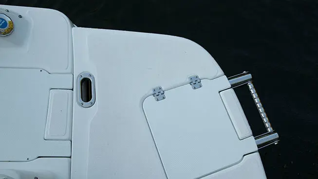 Flip down ladder on the stern of a Hurricane SunDeck Sport I/O deck boat.