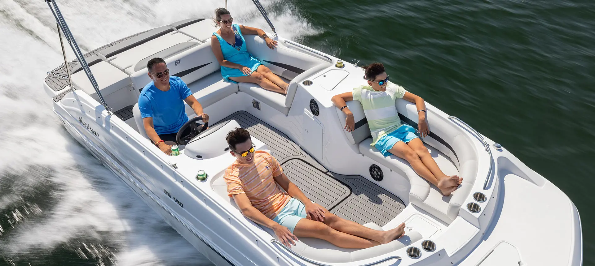 Overhead view of family cruising on a Hurricane SunDeck Sport 188 IO deck boat.