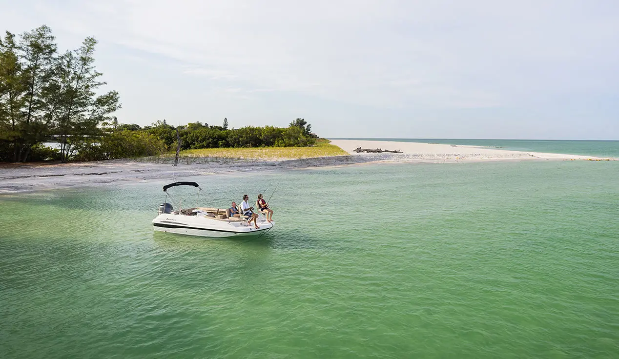 family fishing off the bow of a hurricane sundeck sport ob boat