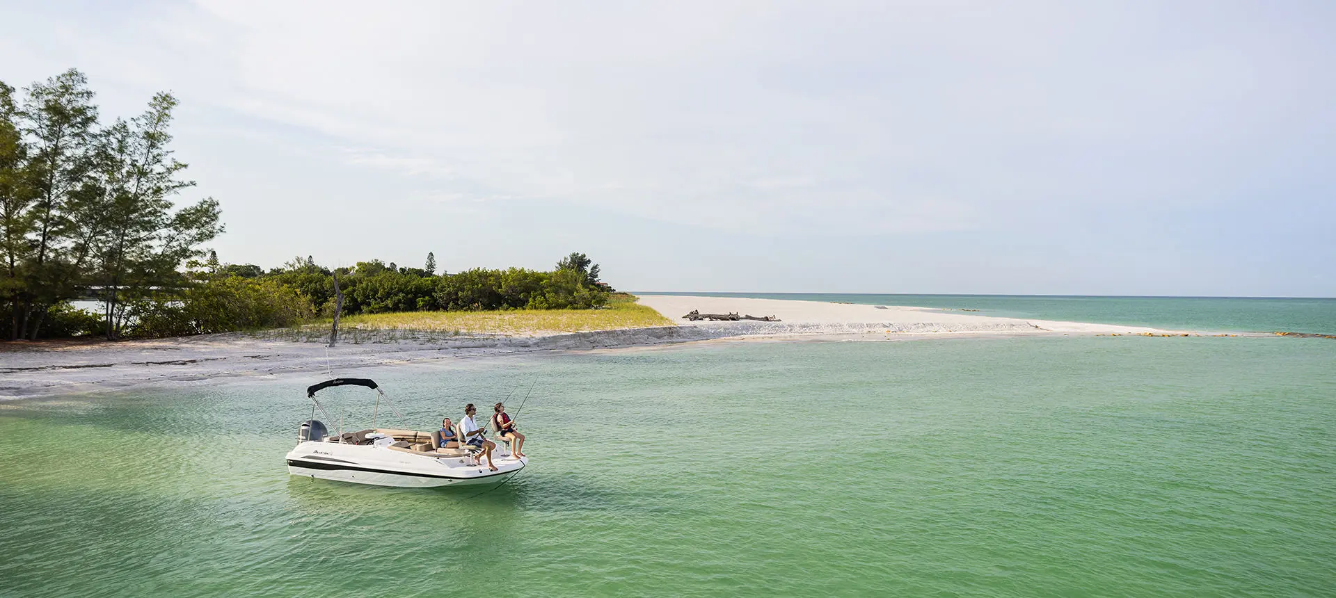 family fishing off the bow of a hurricane sundeck sport ob boat