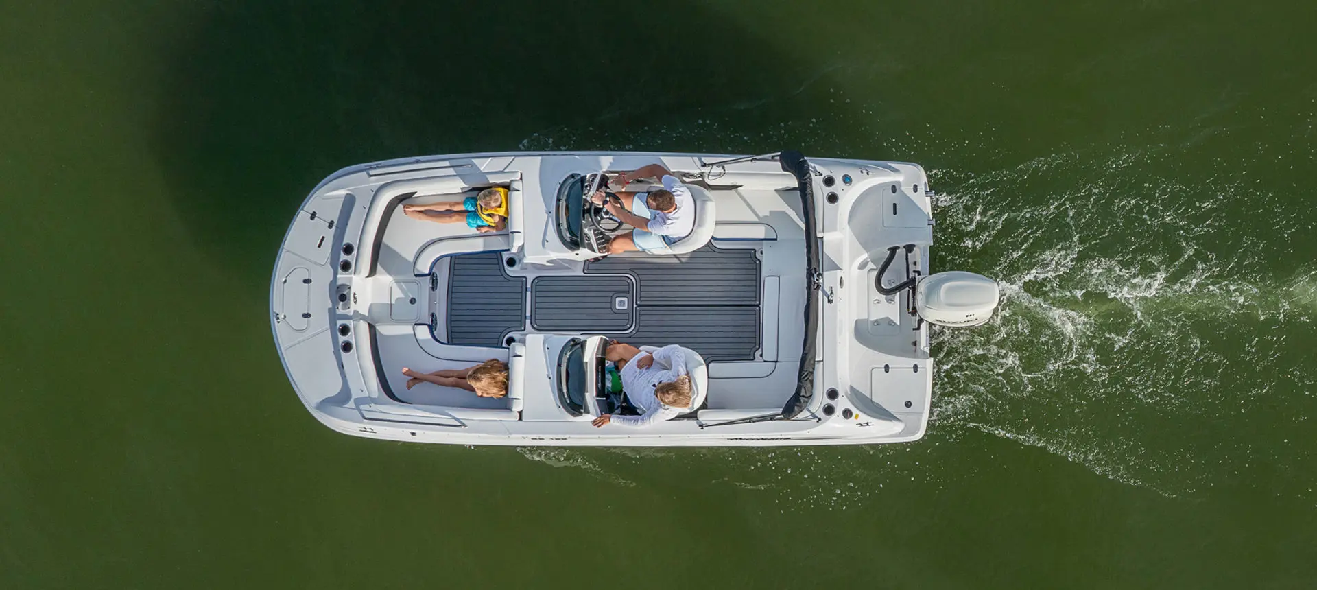 aerial view of a hurricane sundeck sport ob boat floating on a lake
