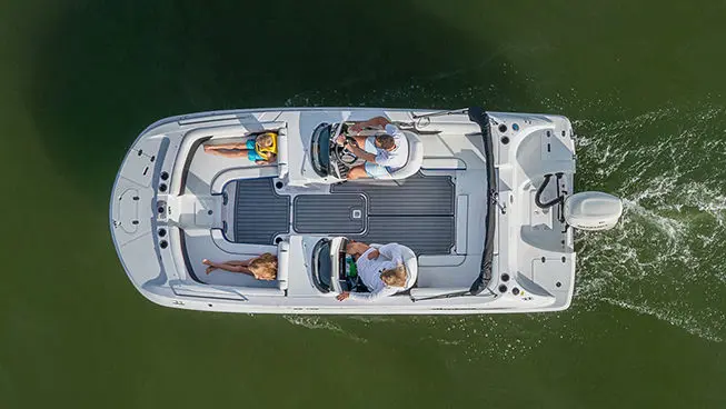 aerial view of a hurricane sundeck sport ob boat floating on a lake