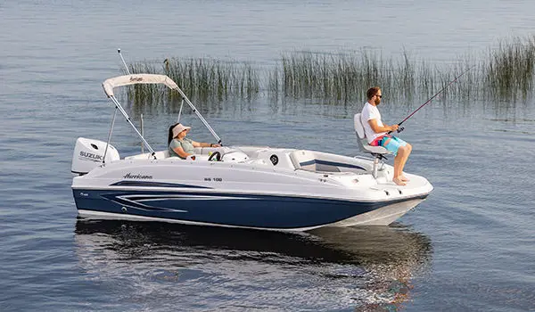 Man fishing off the bow of a Hurricane SunDeck Sport 188 OB deck boat.