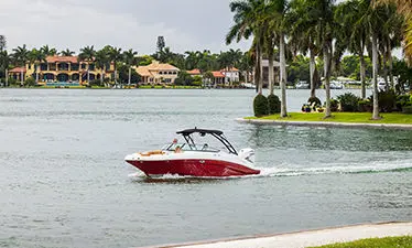 Family cruising the shoreline on a Hurricane Center Console boat.
