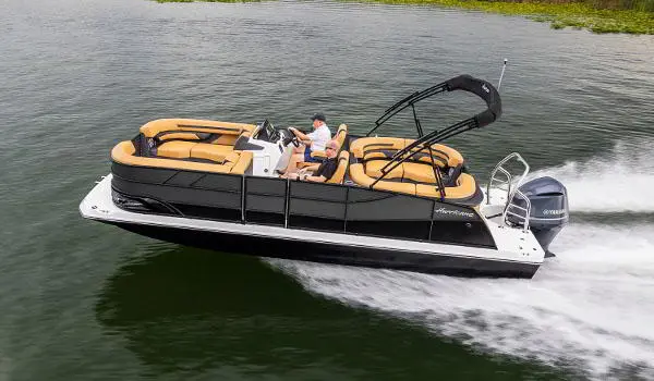 Side view of a Hurricane FunDeck 2360 SBC OB speeding on lake