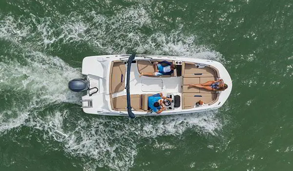 Overhead view of people relaxing on a Hurricane SunDeck Sport 185 OB deck boat.