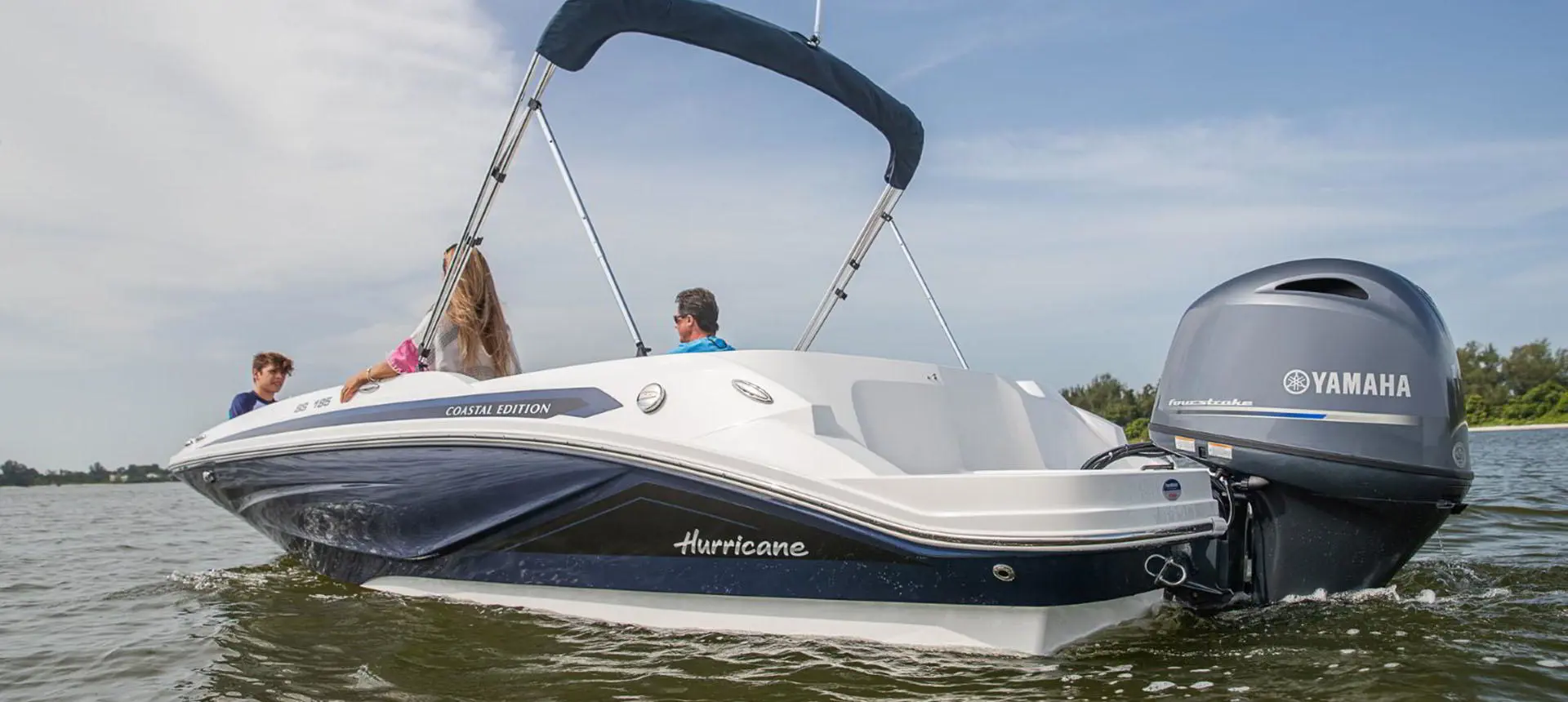 Stern focused view of a Hurricane SunDeck Sport 185 OB deck boat.