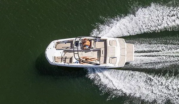 Aerial view of a Hurricane SunDeck Sport 205 IO deck boat on a lake.