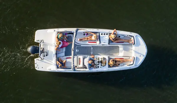 Aerial view of 7 people relaxing on a Hurricane SunDeck Sport 205 OB deck boat.