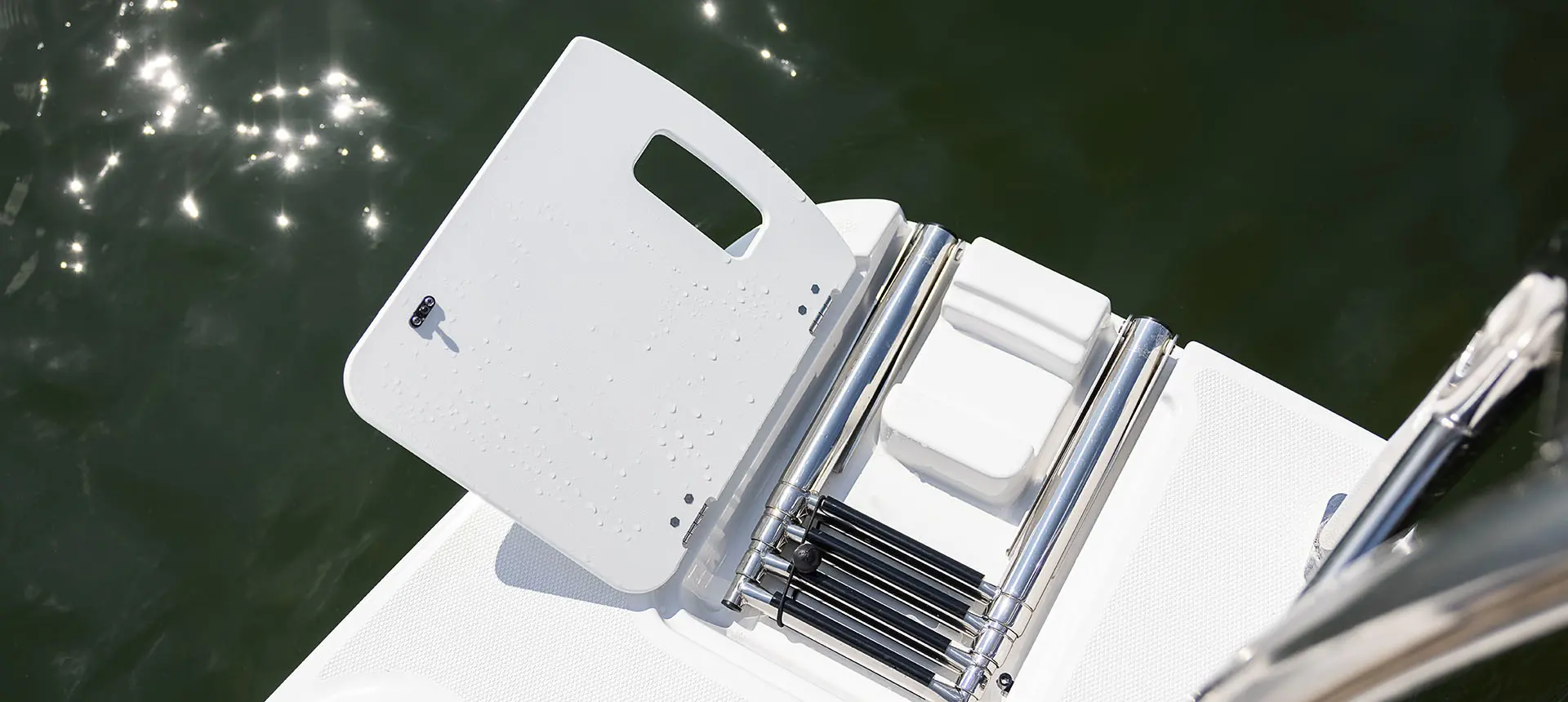 Folding stern ladder on a Hurricane SunDeck Sport 205 OB deck boat.
