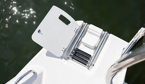 Folding stern ladder on a Hurricane SunDeck Sport 205 OB deck boat.