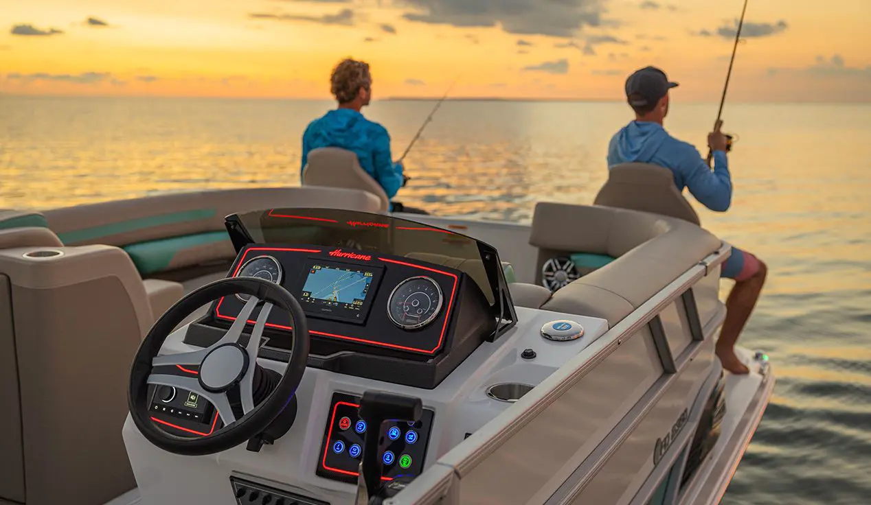 two men fishing off the bow of a hurricane fundeck boat