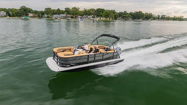 aerial view of a hurricane fundeck boat cruising across a lake
