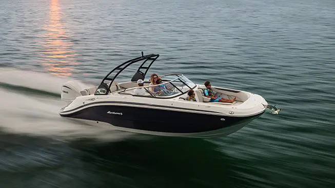 side view of a hurricane sundeck ob boat speeding across the ocean