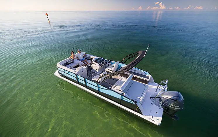 couple relaxing on the stern seats on a hurricane entertainment boat