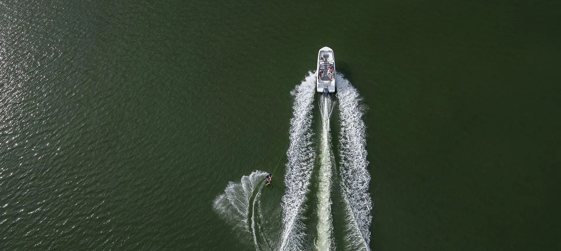 aerial view of a hurricane entertainment boat pulling a wakeboarder