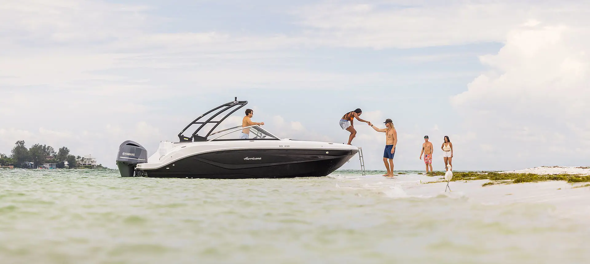 Five friends sailing on their Hurricane