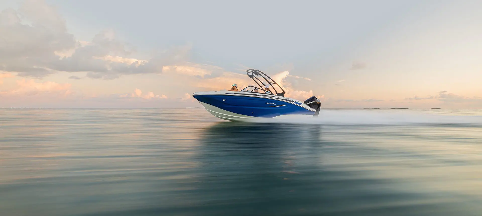 hurricane deck boat speeding across the ocean