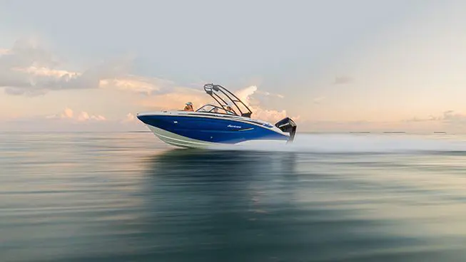 hurricane deck boat speeding across the ocean