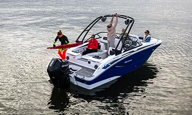 person getting ready to water ski behind a hurriance sport boat
