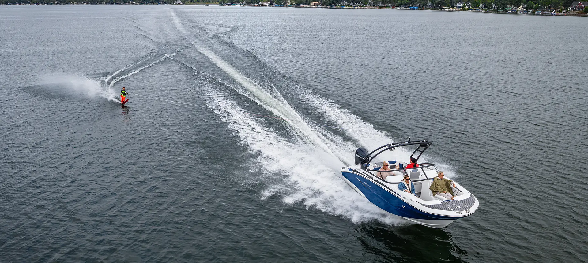 person water skiing behind a hurricane sport boat