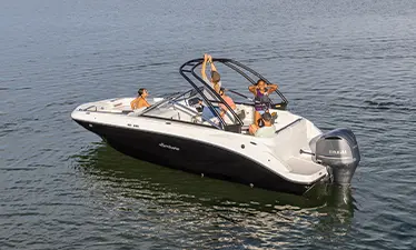 Friends preparing tow bar for watersports on a Hurricane sport boat.
