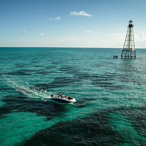 Hurricane deck boat cruising on the ocean.