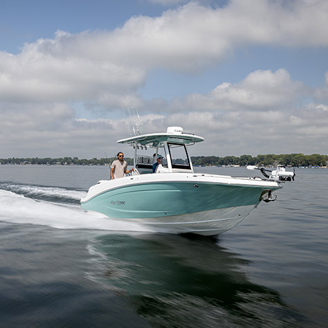Hurricane deck boat cruising on the ocean.