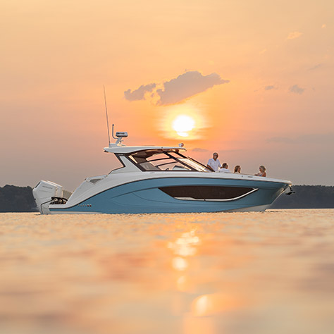Side profile of a Hurricane yacht certified deck boat on the ocean.
