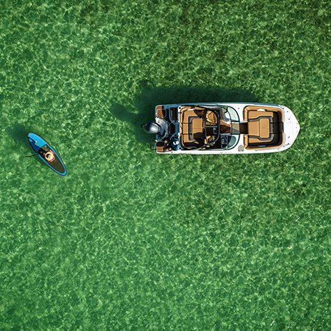 Aerial view of a Hurricane deck boat floating on the ocean.